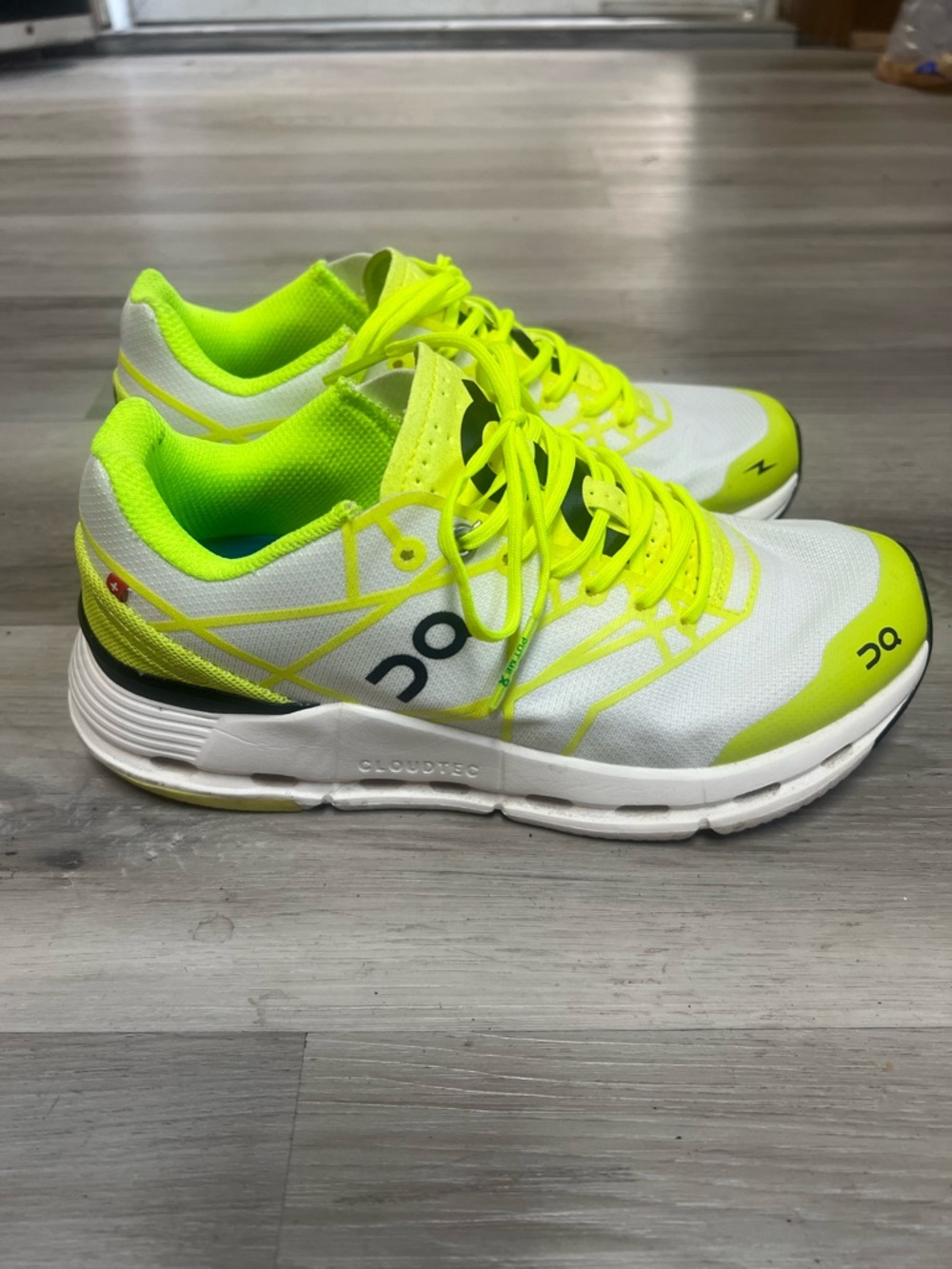 On Running White and Neon Yellow Athletic Running Shoes